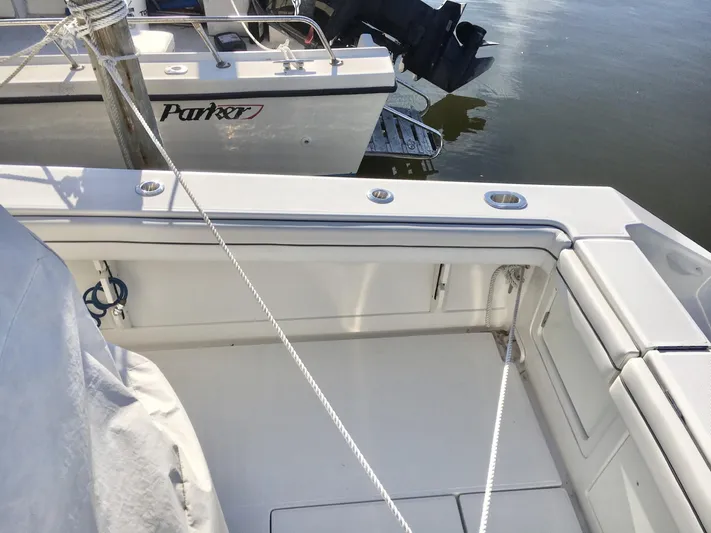  Yacht Photos Pics 2018 Jupiter 29 HFS boat interior with docked Parker boat in background.