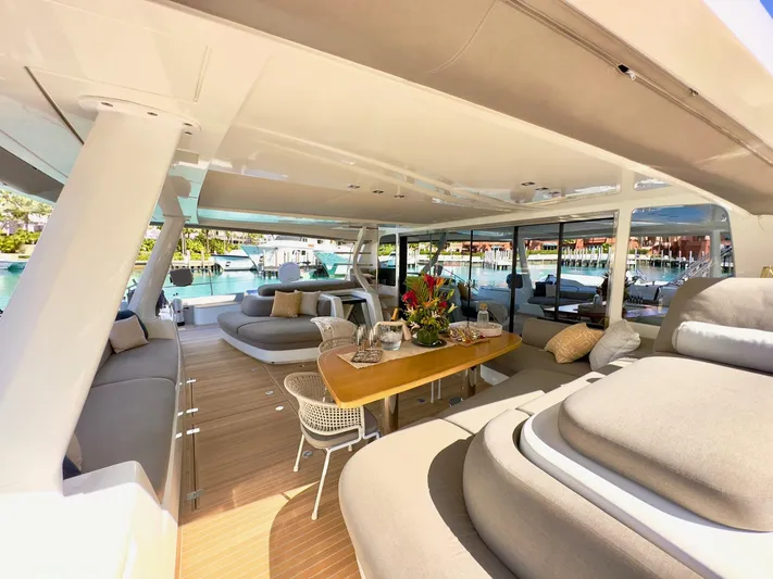 Twin Flame Yacht Photos Pics Luxurious Lagoon Seventy 7 yacht interior with elegant seating and dining area, 2020 model.