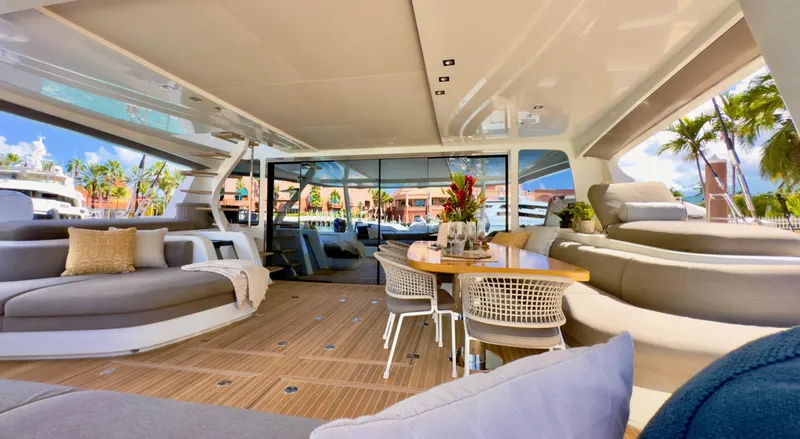 Twin Flame Yacht Photos Pics Luxurious interior of 2020 Lagoon Seventy 7 yacht with elegant seating and dining area.