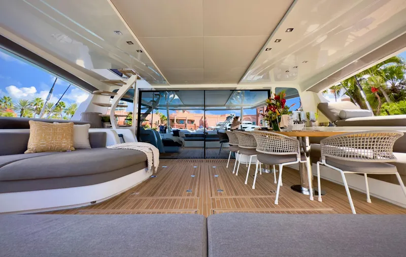 Twin Flame Yacht Photos Pics Luxurious interior of 2020 Lagoon Seventy 7 yacht with elegant seating and dining area.
