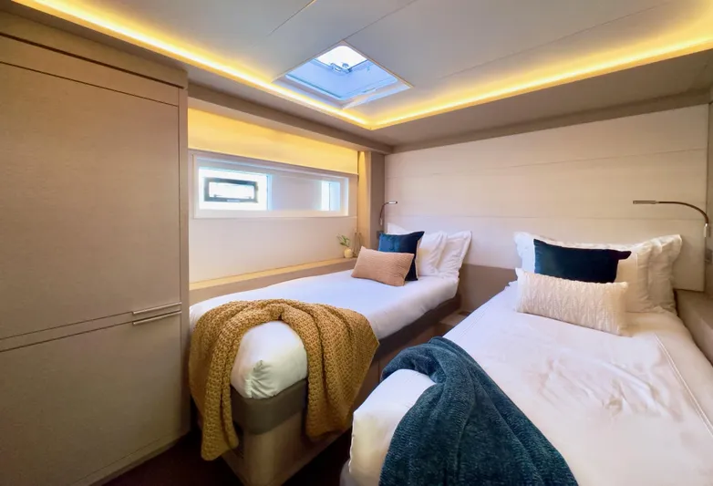 Twin Flame Yacht Photos Pics Luxurious twin cabin interior of 2020 Lagoon Seventy 7 yacht with modern decor.