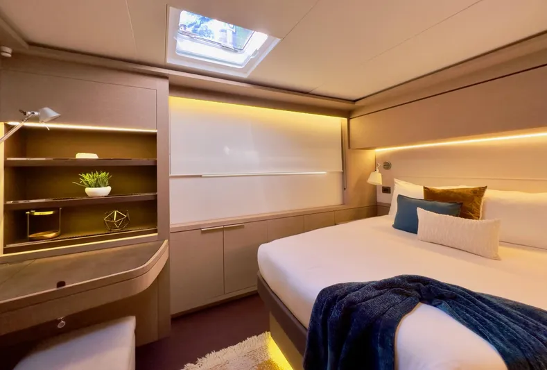 Twin Flame Yacht Photos Pics Luxurious 2020 Lagoon Seventy 7 yacht bedroom with modern decor and ambient lighting.