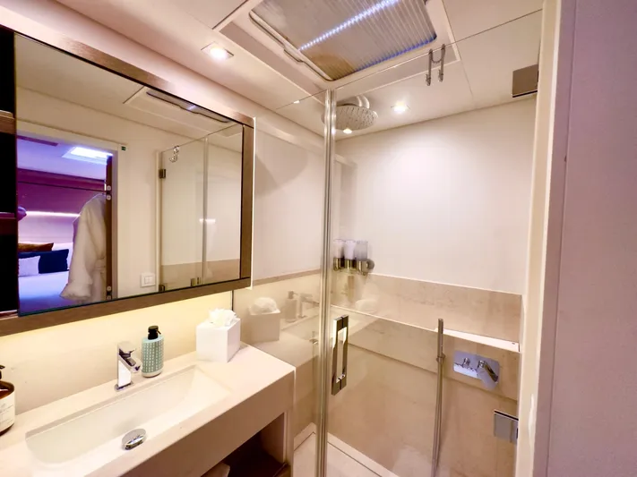 Twin Flame Yacht Photos Pics Luxurious bathroom in 2020 Lagoon Seventy 7 yacht with modern fixtures and spacious shower.