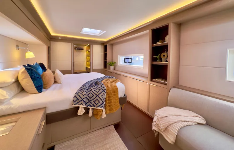 Twin Flame Yacht Photos Pics Luxurious 2020 Lagoon Seventy 7 yacht bedroom with modern decor and cozy bedding.