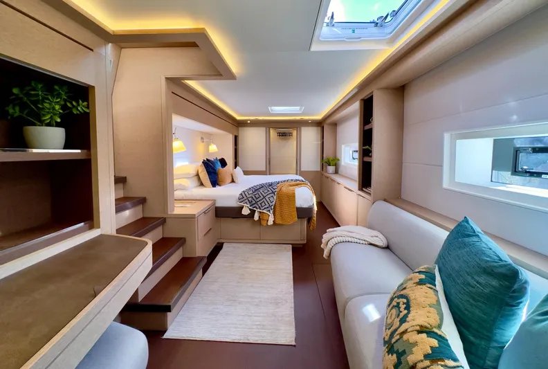 Twin Flame Yacht Photos Pics Luxurious interior of 2020 Lagoon Seventy 7 yacht with modern decor and cozy seating.