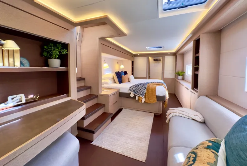 Twin Flame Yacht Photos Pics Luxurious interior of 2020 Lagoon Seventy 7 yacht with modern furnishings and ambient lighting.