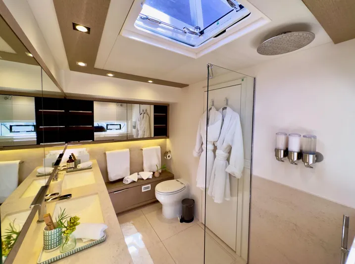 Twin Flame Yacht Photos Pics Luxurious bathroom in 2020 Lagoon Seventy 7 yacht with modern amenities and elegant design.