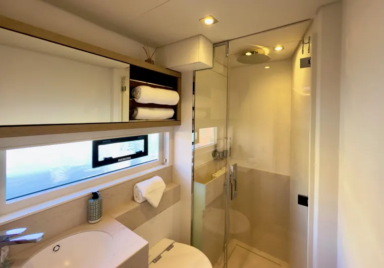 Twin Flame Yacht Photos Pics Luxurious bathroom in 2020 Lagoon Seventy 7 yacht with modern shower and elegant fixtures.