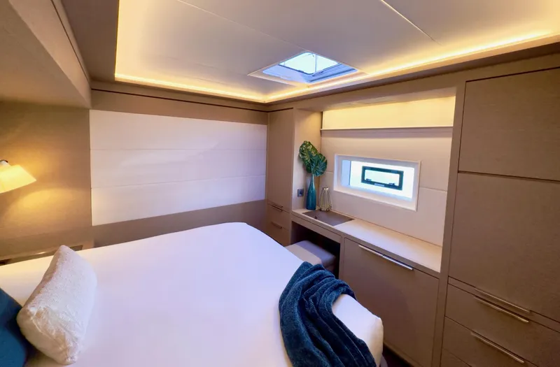 Twin Flame Yacht Photos Pics Luxurious cabin interior of 2020 Lagoon Seventy 7 yacht with modern design and cozy lighting.