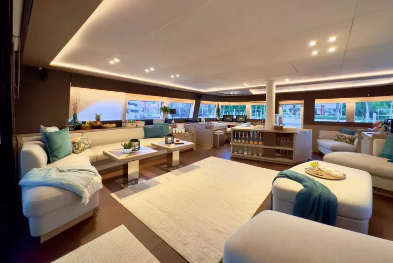 Twin Flame Yacht Photos Pics Luxurious interior of 2020 Lagoon Seventy 7 yacht with elegant seating and modern decor.