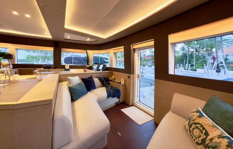 Twin Flame Yacht Photos Pics Luxurious interior of 2020 Lagoon Seventy 7 yacht with modern seating and ambient lighting.
