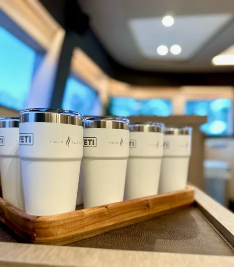 Twin Flame Yacht Photos Pics White YETI cups on wooden tray inside Lagoon Seventy 7 yacht, 2020 model.