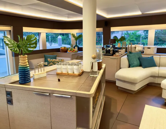 Twin Flame Yacht Photos Pics Luxurious interior of 2020 Lagoon Seventy 7 yacht with modern decor and comfortable seating.