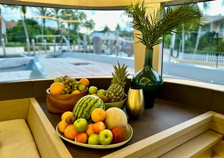 Twin Flame Yacht Photos Pics Luxurious Lagoon Seventy 7 yacht interior with fresh fruit and elegant decor, 2020 model.