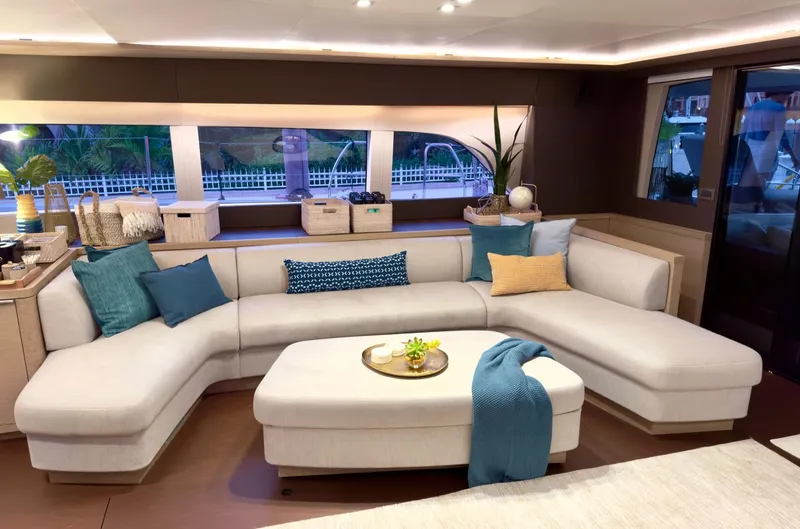 Twin Flame Yacht Photos Pics Luxurious interior of 2020 Lagoon Seventy 7 yacht with elegant seating and decor.