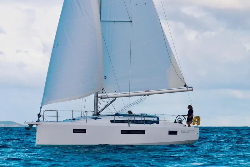 Endless Summer Yacht Photos Pics 2024 Jeanneau Sun Odyssey 410 sailing on open water under clear skies.