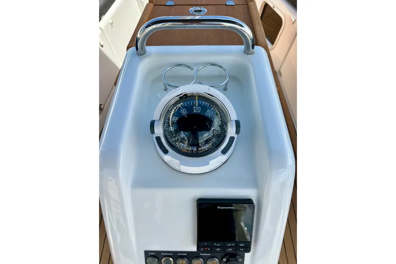 Endless Summer Yacht Photos Pics Compass and navigation controls on 2024 Jeanneau Sun Odyssey 410 yacht.