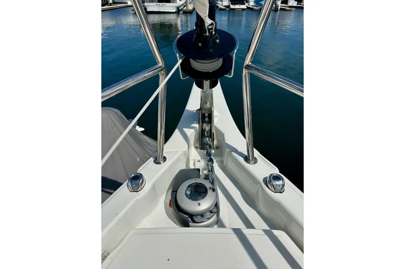 Endless Summer Yacht Photos Pics Bow of 2024 Jeanneau Sun Odyssey 410 sailboat with anchor chain and winch.