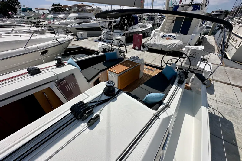 Endless Summer Yacht Photos Pics 2024 Jeanneau Sun Odyssey 410 sailboat with dual helm, docked at marina.