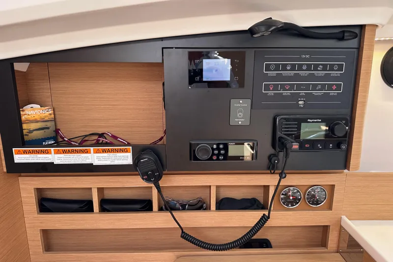 Endless Summer Yacht Photos Pics Control panel of 2024 Jeanneau Sun Odyssey 410 yacht with navigation and communication equipment.