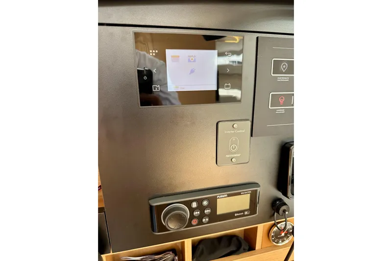 Endless Summer Yacht Photos Pics Control panel of 2024 Jeanneau Sun Odyssey 410 yacht with touchscreen and audio system.