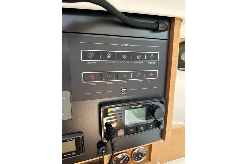 Endless Summer Yacht Photos Pics Control panel of 2024 Jeanneau Sun Odyssey 410 sailboat with navigation and electronic systems.
