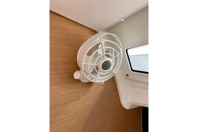 Endless Summer Yacht Photos Pics Wall-mounted fan inside 2024 Jeanneau Sun Odyssey 410 yacht cabin.