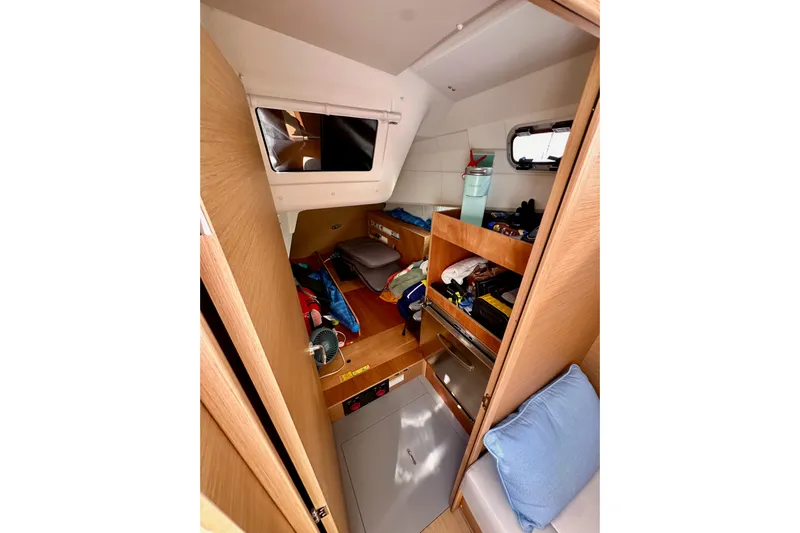 Endless Summer Yacht Photos Pics Interior cabin of 2024 Jeanneau Sun Odyssey 410 sailboat, featuring storage and seating.