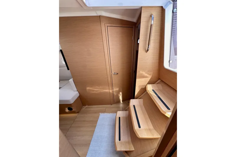 Endless Summer Yacht Photos Pics Interior of 2024 Jeanneau Sun Odyssey 410, featuring wooden steps and modern design.