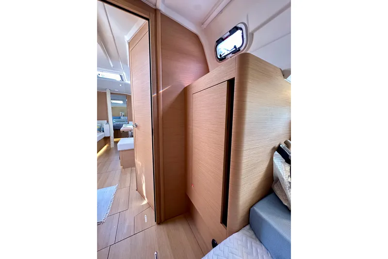 Endless Summer Yacht Photos Pics Interior of 2024 Jeanneau Sun Odyssey 410 yacht, featuring modern wood finishes and cozy cabin space.