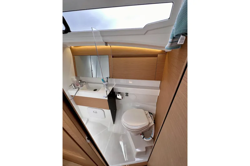 Endless Summer Yacht Photos Pics 2024 Jeanneau Sun Odyssey 410 bathroom with modern fixtures and sleek design.