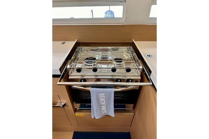 Endless Summer Yacht Photos Pics Modern kitchen stove in 2024 Jeanneau Sun Odyssey 410 yacht interior.