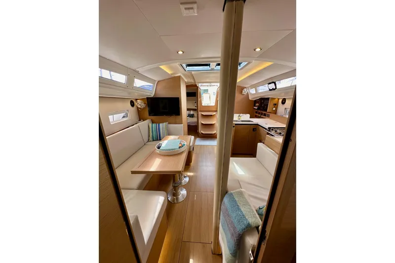 Endless Summer Yacht Photos Pics Interior of 2024 Jeanneau Sun Odyssey 410 yacht, featuring modern design and cozy seating.