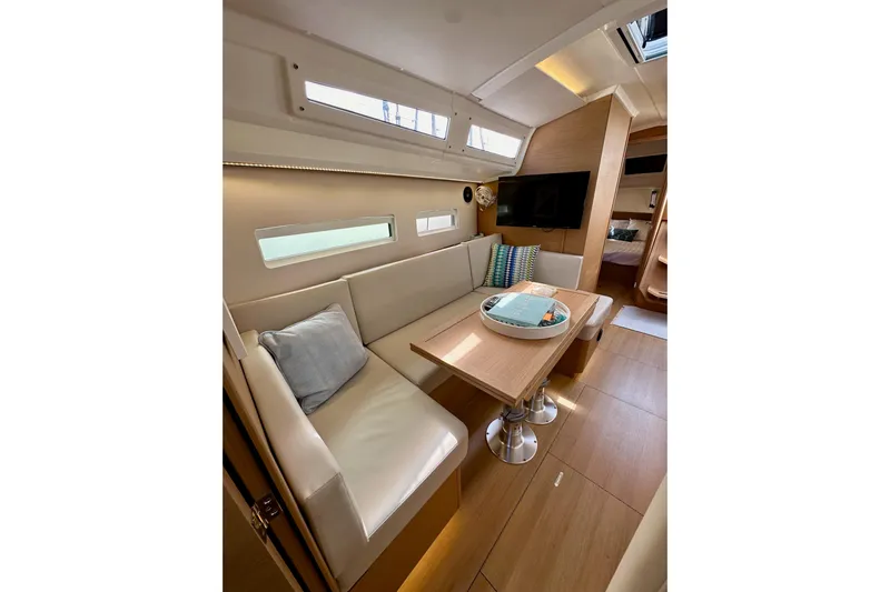 Endless Summer Yacht Photos Pics 2024 Jeanneau Sun Odyssey 410 interior with cozy seating and modern design.