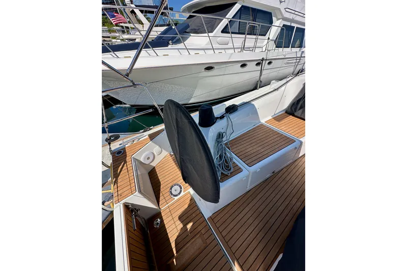 Endless Summer Yacht Photos Pics 2024 Jeanneau Sun Odyssey 410 sailboat with teak deck and mooring lines.