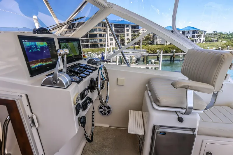 Patriot Yacht Photos Pics 2005 Carolina Classic 32 boat cockpit with navigation screens and seating, dockside view.