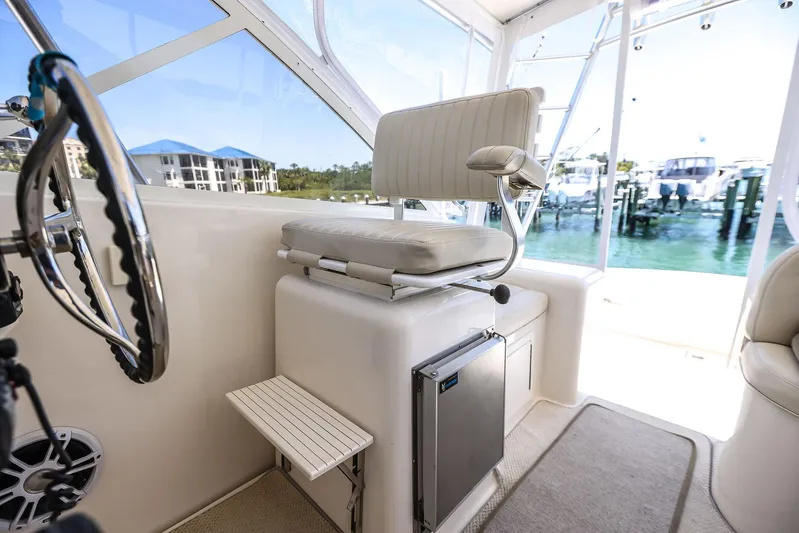 Patriot Yacht Photos Pics 2005 Carolina Classic 32 boat interior with helm seat and marina view.