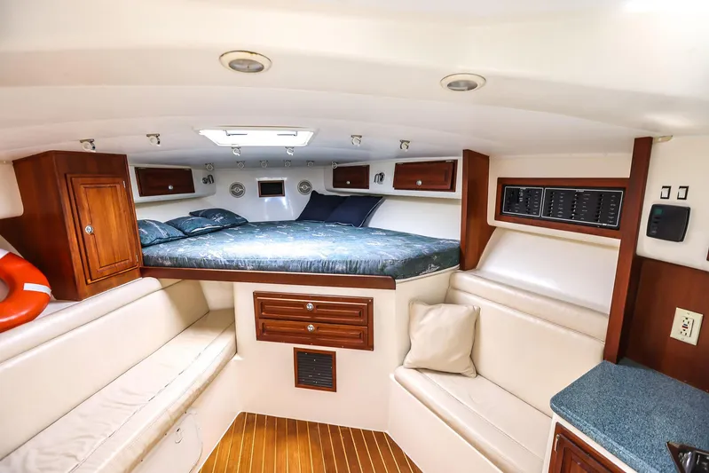 Patriot Yacht Photos Pics Interior of 2005 Carolina Classic 32 boat with cozy cabin and wooden accents.