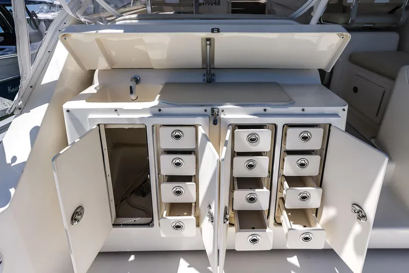 Patriot Yacht Photos Pics 2005 Carolina Classic 32 boat storage compartments with open drawers and cabinets.
