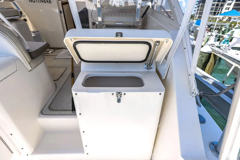 Patriot Yacht Photos Pics 2005 Carolina Classic 32 boat with open storage compartment on deck.