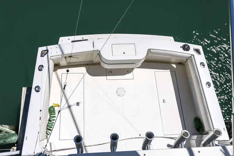 Patriot Yacht Photos Pics 2005 Carolina Classic 32 boat deck, spacious layout, fishing rod holders, clean white surface.