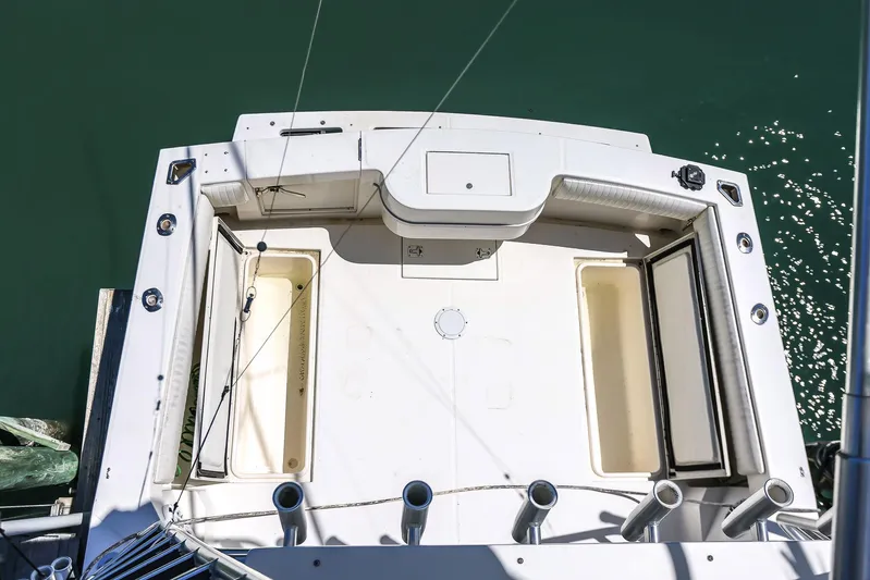 Patriot Yacht Photos Pics 2005 Carolina Classic 32 boat deck, spacious layout, fishing rod holders, and storage compartments.