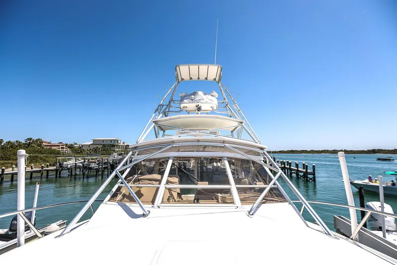 Patriot Yacht Photos Pics 2005 Carolina Classic 32 boat docked, clear sky, waterfront view.