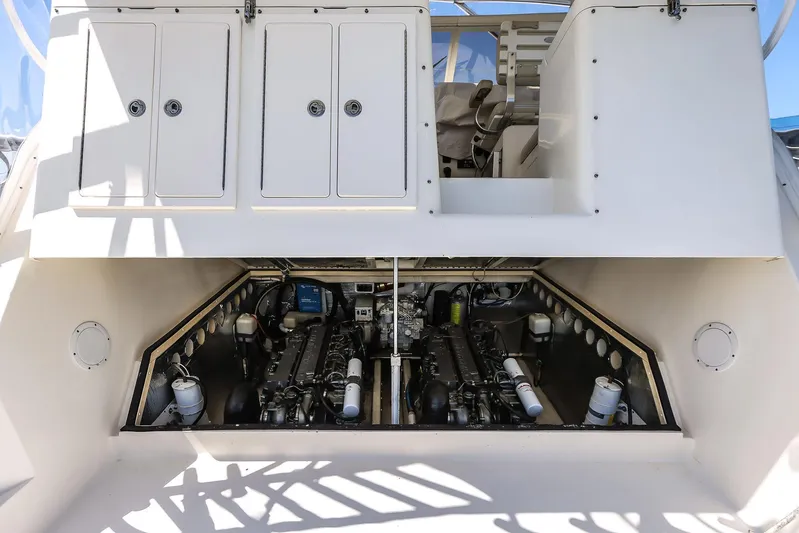Patriot Yacht Photos Pics 2005 Carolina Classic 32 boat engine compartment with dual engines and storage cabinets.