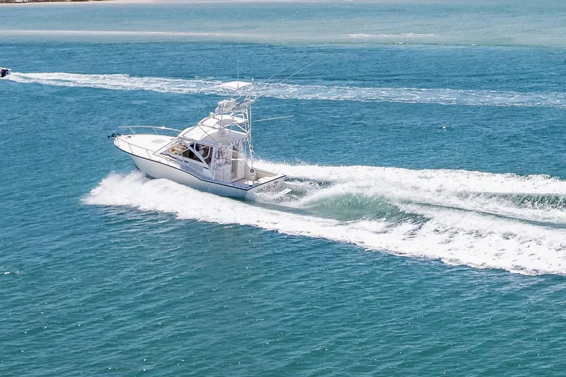 Patriot Yacht Photos Pics 2005 Carolina Classic 32 boat cruising on open blue water.