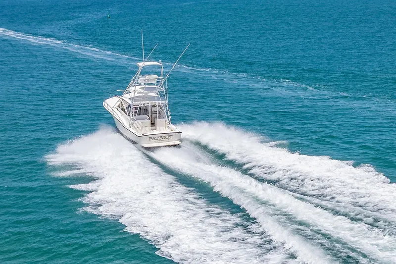 Patriot Yacht Photos Pics 2005 Carolina Classic 32 boat cruising on open blue water.