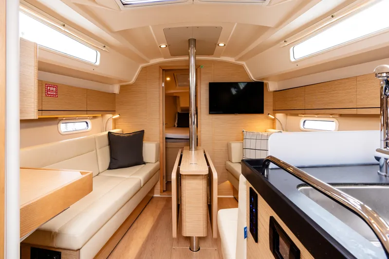 The Siren's Song Yacht Photos Pics Interior of 2023 Hanse 348 yacht, featuring modern design and comfortable seating.