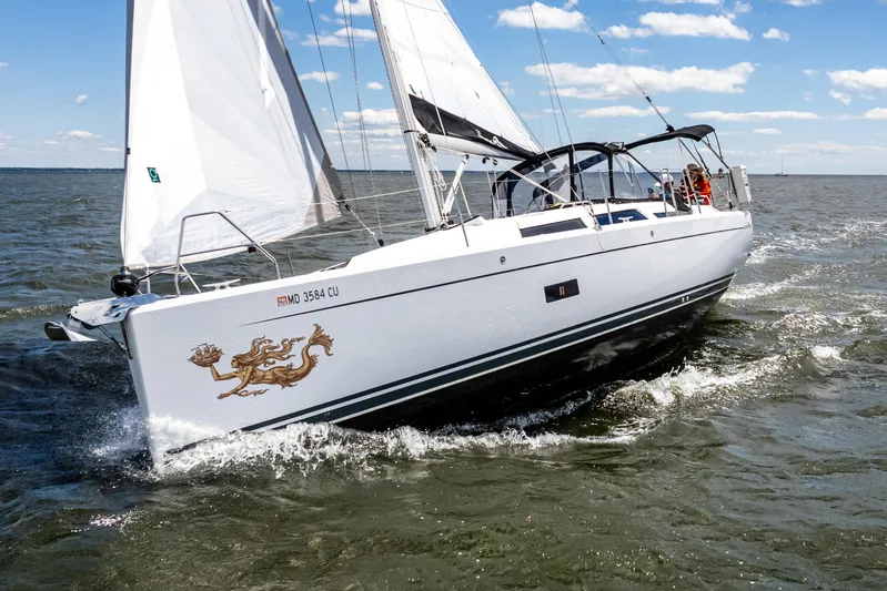 The Siren's Song Yacht Photos Pics 2023 Hanse 348 sailboat navigating open waters under clear skies.