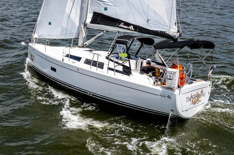 The Siren's Song Yacht Photos Pics 2023 Hanse 348 sailboat cruising on open water, featuring sleek design and white sails.