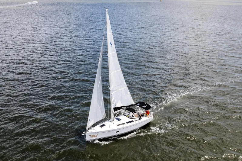 The Siren's Song Yacht Photos Pics 2023 Hanse 348 sailboat navigating open waters with full sails.
